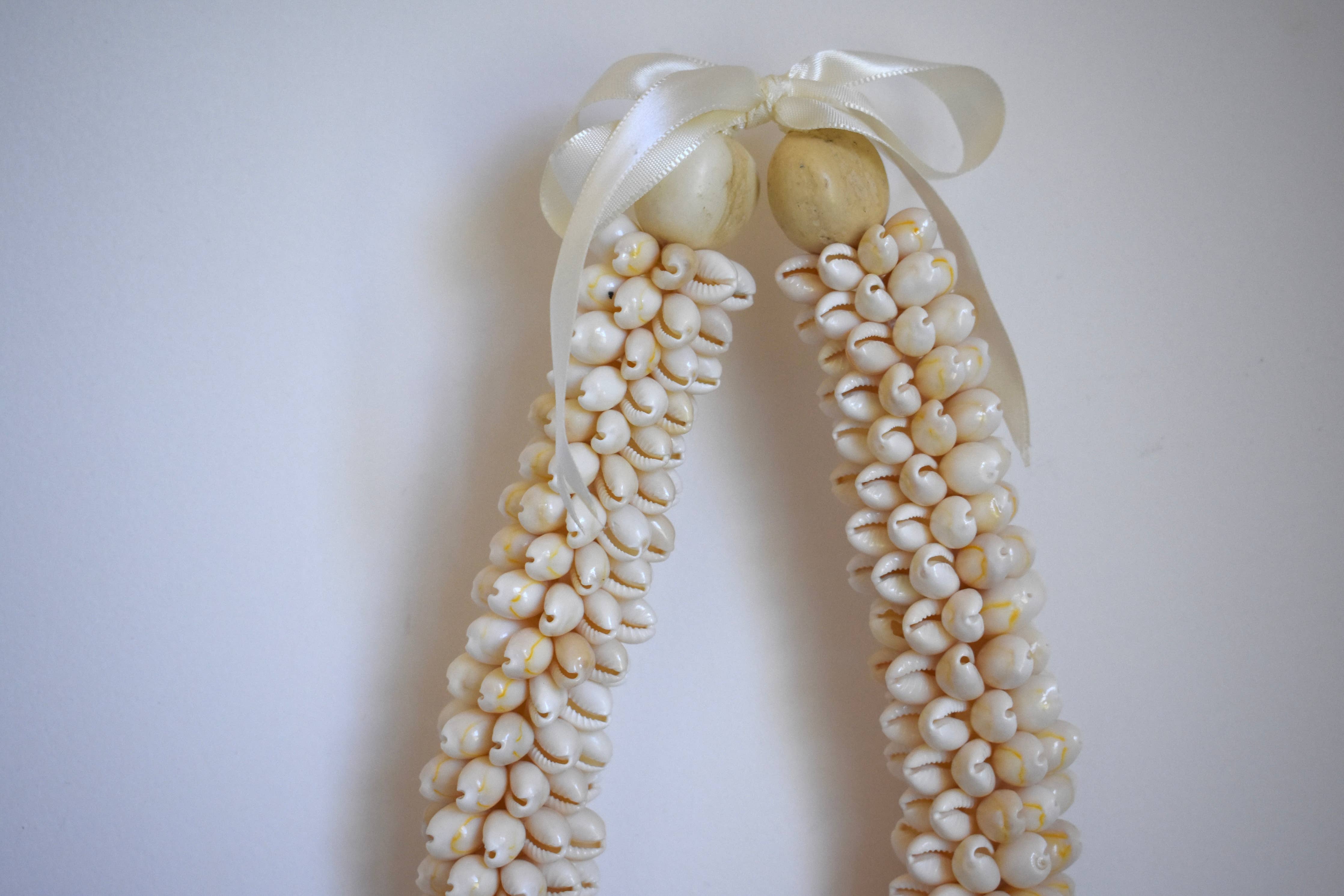 Chunky Cowrie Shell Lei: Black Kukui Nuts